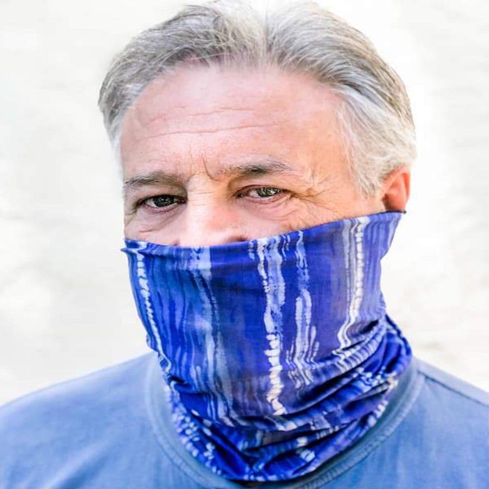 Adult male wearing a blue dreams pattern face cover by Jolina Boutique