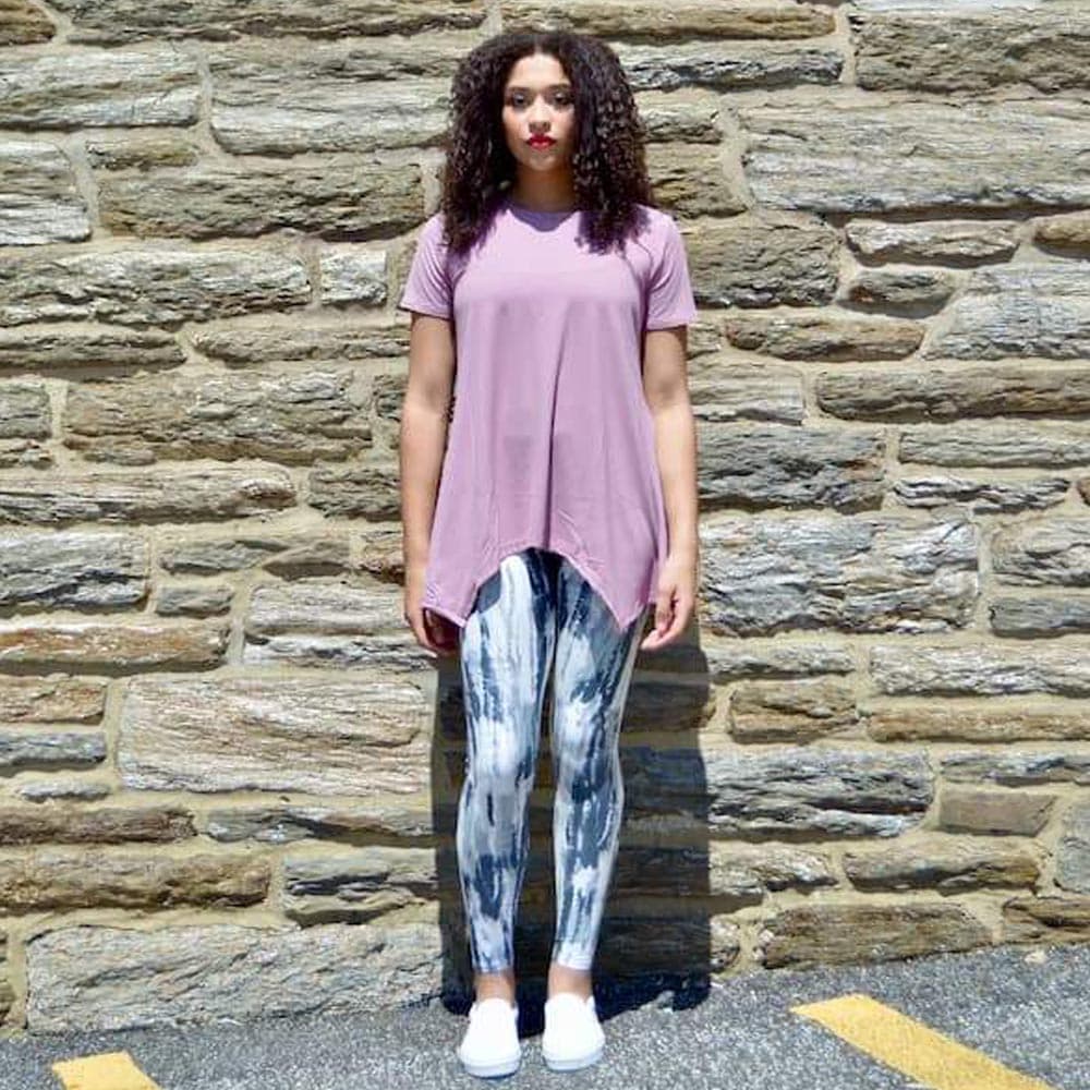 Model showing the front view of gray haze pattern leggings by Jolina Boutique.