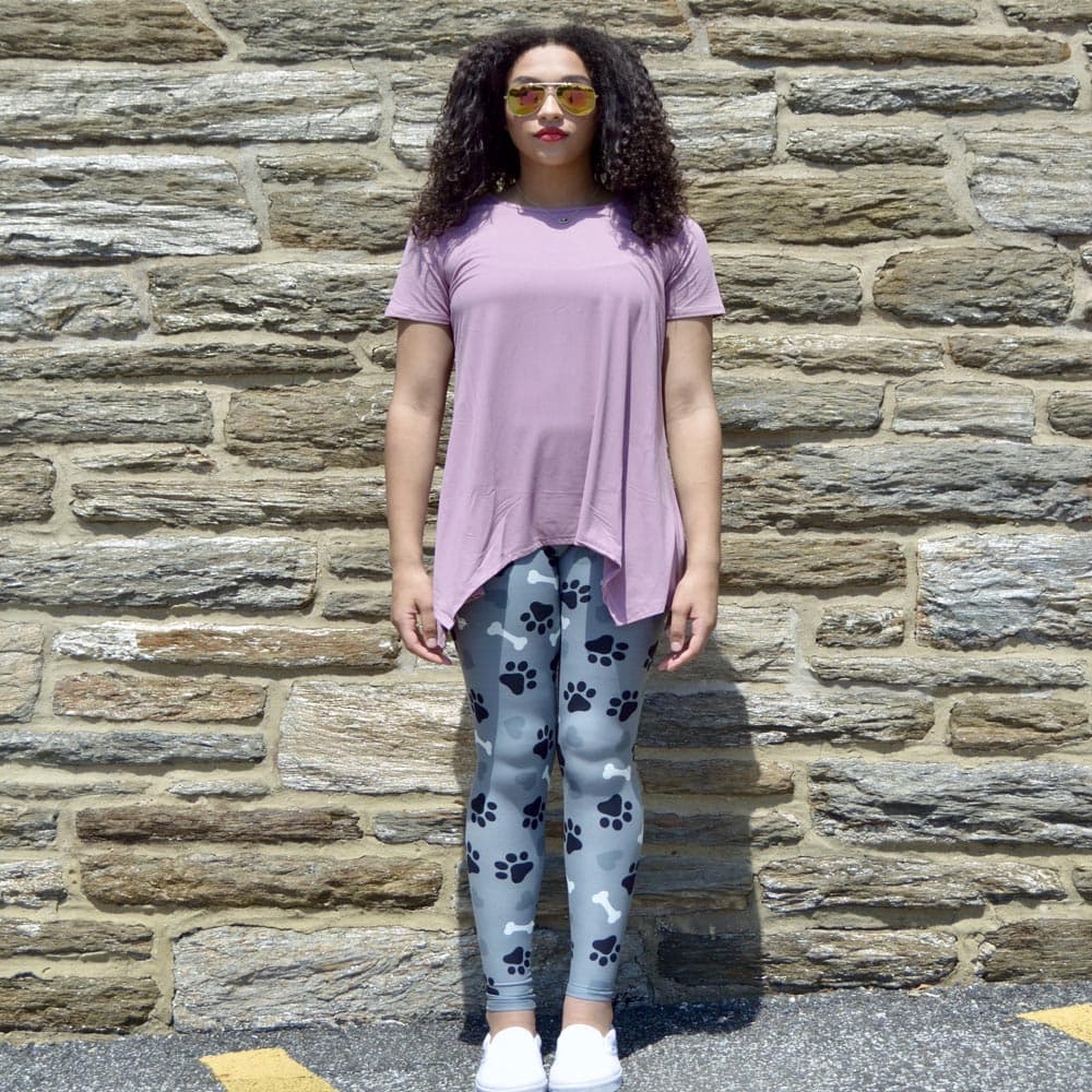 Model showing off her puppy love pattern leggings by Jolina Boutique