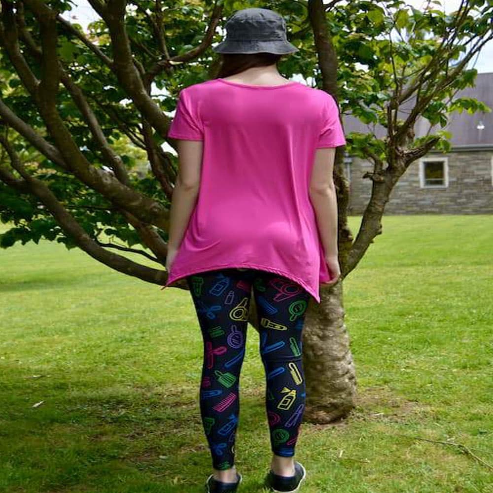 Model showing back view of sassy stylist pattern leggings by Jolina Boutique