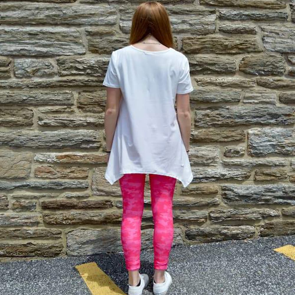 Model showing back view of pink camo leggings